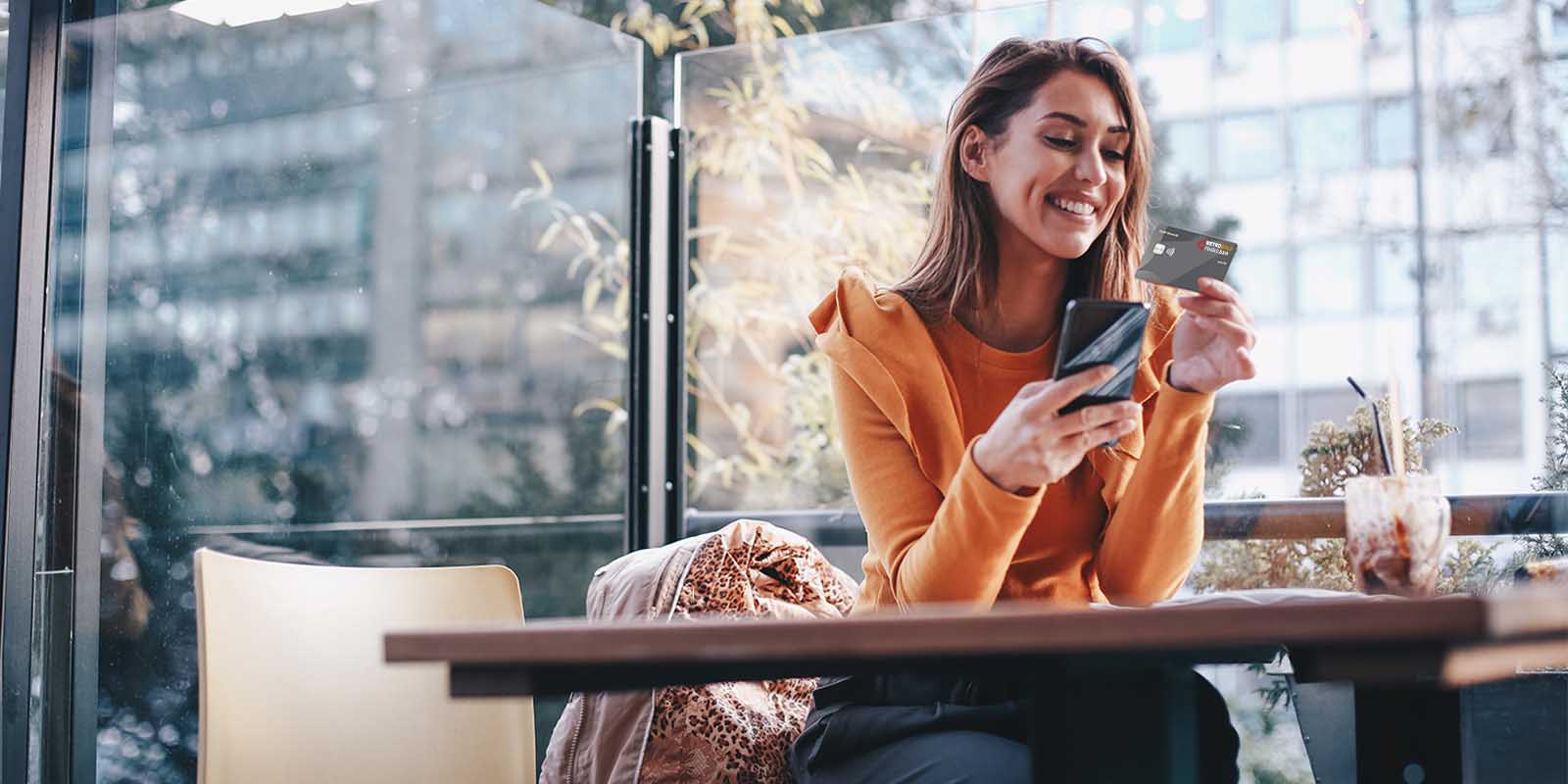 A customer using mobile banking in the city